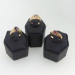 A 9ct yellow gold garnet Ring, the oval facetted stone 7.3mm long collet set with fluted