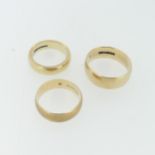 A thick 9ct yellow gold Band, Size K½, together with two others, Size R and M½, total weight 14.