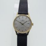 A 9ct yellow gold Garrard quartz Wristwatch, the reverse with presentation inscription dated 1990,
