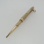 Sampson Mordan; A 9ct gold Propelling Pencil, hallmarked London, 1916, the body with engine turned
