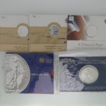 A Royal Mint Britannia £50 fine silver Coin, dated 2015, in carded blister pack, together with