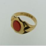 An 18ct yellow gold Signet Ring, the shield shaped front set with a vacant oval carnelian, Size P,