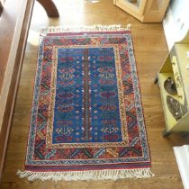 Tribal Rugs; a blue ground Caucasian Rug, with tree of life designs and geometric patterned