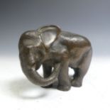 A Japanese Meiji period bronze Elephant, signed with character marks to two feet, lacking tusks, H