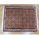 Tribal Rugs; a small dark rust ground Persian Herati rug, of high quality, with finely knotted