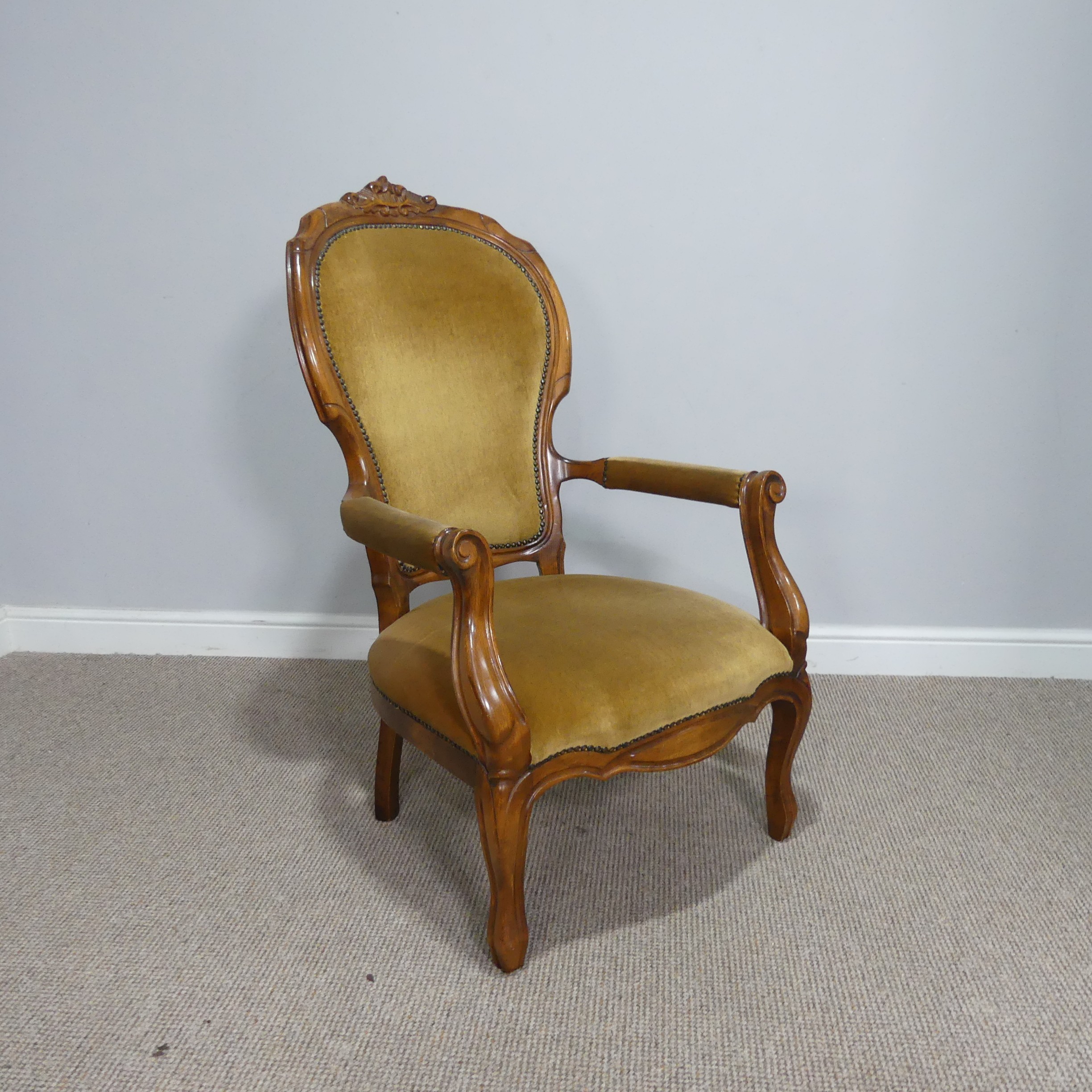 A Victorian mahogany upholstered open Armchair, W 62cm x H 106.5 cm x D 60 cm.