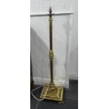 An Antique brass standard Lamp, on square base, H 130 cm.