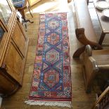 Tribal Rugs; a blue ground Caucasian Runner, the whole with typical geometric patterns in bright