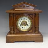 A Victorian oak mantel Clock, brass and enamel dial with Arabic chapter, movement stamped with '