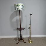 An Early 20thC mahogany standard Lamp with reading table, H 168.5 cm, together with a brass standard