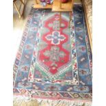 Tribal Rugs: an old Turkish hand knotted wool rug, the whole woven with bold geometric patterns in