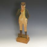 An Antique Folk art Figure of a farmer, painted on cut out board, raised on block, W 16.5 cm x H