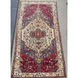 Tribal Rugs; a large Persian Qashqai Rug, red, cream and grey ground with all over typical patterns,