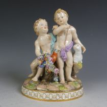 A 19thC Meissen porcelain Group, modelled as a pair of Cupids with parrot and a lamb, missing an