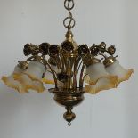 A brass six branch 'Rose' Chandelier, the six branches each with a glass shade, surrounded by