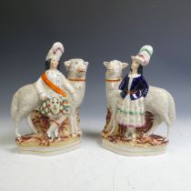 A pair of 19thC Staffordshire figures of Scottish Dancers with Sheep, each on gilt line plinth base,