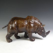 An Abercrombie & Fitch style leather model of a Rhinoceros, affectionately known by the vendor as '