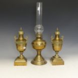 An Antique brass Oil Lamp and two decorative brass Garniture Vases, together with another Oil Lamp