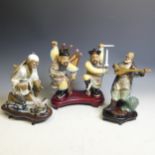 A 20thC Chinese pottery figure of a Musician, modelled with string instrument, H 25cm (including