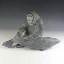 Inuit Art, possibly the work of Echalook Goo (Inuit, 1914-1989); a carved and polished soapstone sc