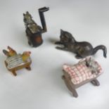 An antique Austrian cold painted bronze of a Cat cooking a Rat, modelled with a large kiln, together