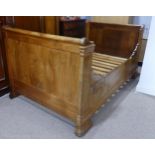 A Continental walnut small double / large single Sleigh Bed, W 131 cm x H 106 cm x D 225 cm.