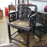An Antique carved and pierced Chinese hardwood Armchair, W 62 cm x H 98 cm x D 47 cm.