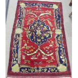 Tribal Rugs; a Persian Rug, red ground with bold patterns, wool pile on wool base, pile and