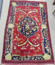 Tribal Rugs; a Persian Rug, red ground with bold patterns, wool pile on wool base, pile and