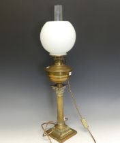 A 19thC French brass corinthian column oil Lamp, converted to electricity, H 73 cm.