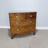 An Early 19thC mahogany bow-front Chest of drawers, with mismatching top right drawer, W 91 cm x H