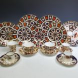 A quantity of Royal Crown Derby 1128 pattern Pieces, comprising two large Dinner Plates, two smaller