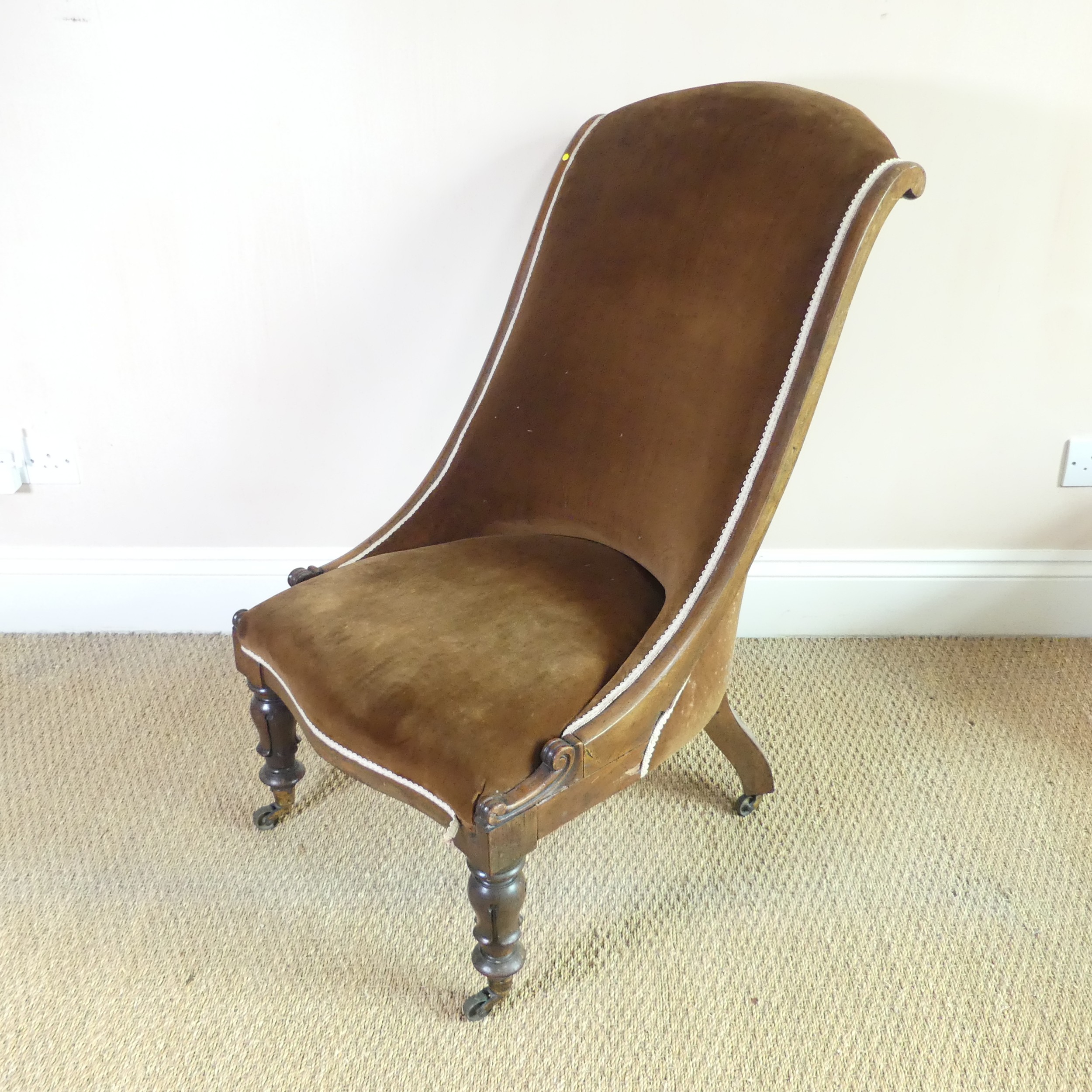 A Victorian mahogany show-frame nursing Chair, serpentine front, with brown upholstery, W 54 cm x