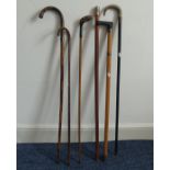 A Vintage Sunday Stick, together with five other walking canes (6)