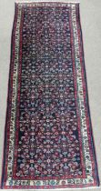 Tribal Rugs; a Persian Herati Runner, very dark navy ground, wool pile on cotton base, 293cm x