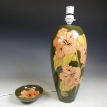 A Moorcroft 'Hibiscus' pattern Lamp Base, with green ground and pink flower, together with a