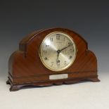 A 20th century mahogany mantle Clock with chiming movement, circular silvered dial inscribed '