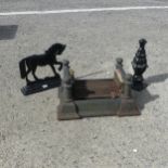 A Vintage cast iron boot Scraper, together with two cast iron door stops(3)