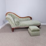 A Victorian mahogany button back Chaise longue, with carved decoration, upon large turned legs and
