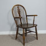 An Antique ash and elm Windsor Chair, shaped and pierced splat back, upon saddle seat raised on