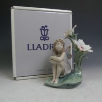 A Lladro porcelain figure of 'Lakeside Daydream', with factory marks to base, boxed.