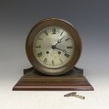 An American "Ship's Bell" mantel Clock, with 8-day striking movement, retailed by Goldsmiths &