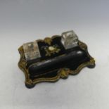 A Victorian black lacquered gilt and painted Inkwell, with both glasses, raised on bun feet, W 22