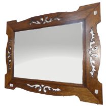 An Arts and Crafts oak wall Mirror, frame with Pierced edges, encasing bevelled plate, W 64 cm x H