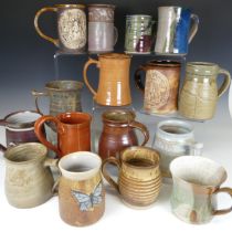 A large collection of Studio Pottery Mugs, comprising Keith Smith examples, Dartington Pottery, etc.