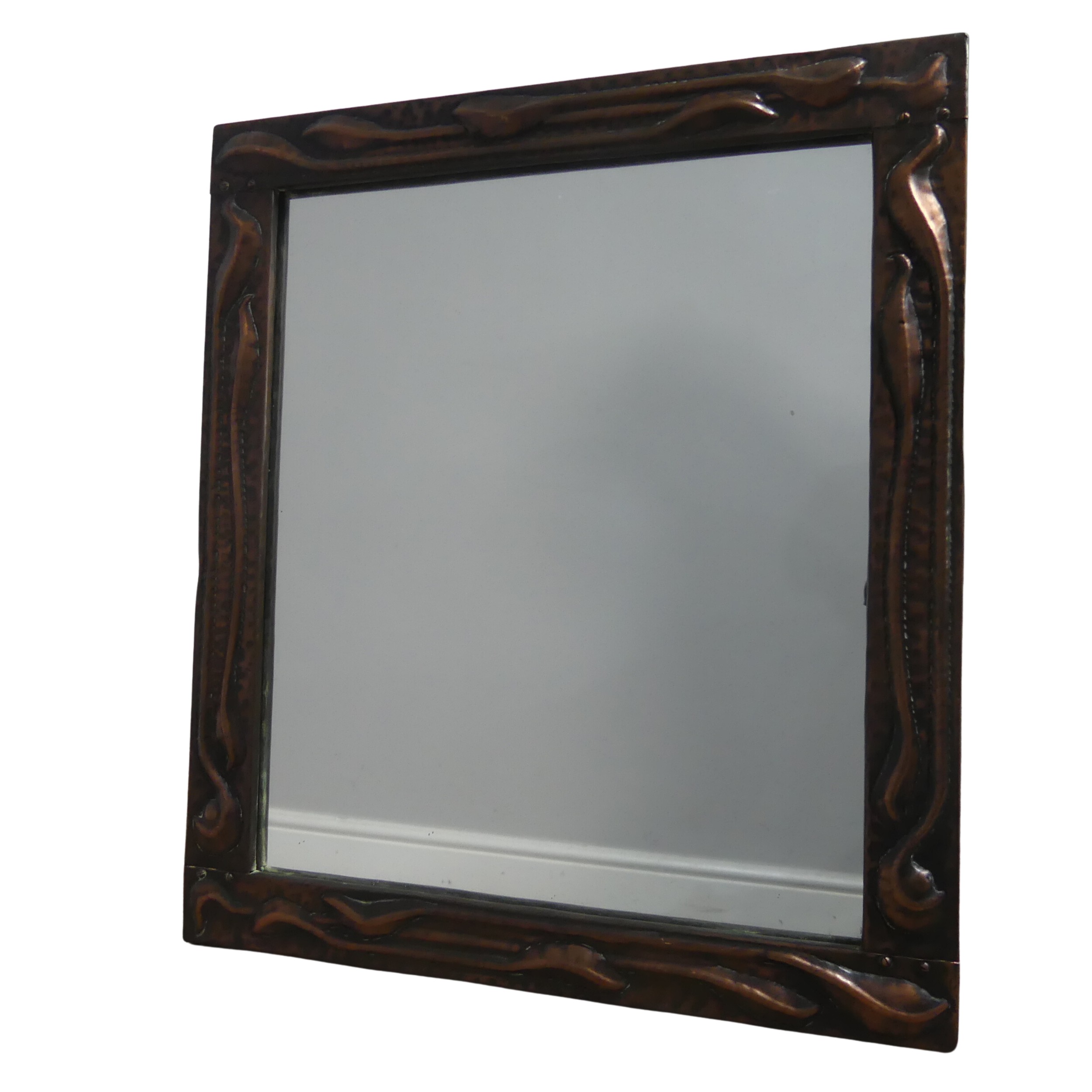 An Arts and crafts copper wall Mirror : Attributed to John Pearson circa 1900, the rectangular
