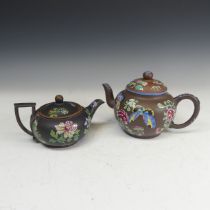 A Chinese Yixing famille rose Teapot, decorated in enamels with flora and fauna, staple repair to