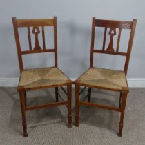 A pair of Arts and Crafts oak Bedroom side Chairs, with bar back and a shaped splat with heart-