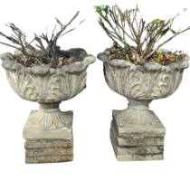 A Pair of weathered reconstituted stone garden Urns, with circular acanthus/cabbage leaf bowls,