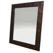 A large Arts and Crafts wall Mirror in the manner of John Pearson, copper and oak rectangular